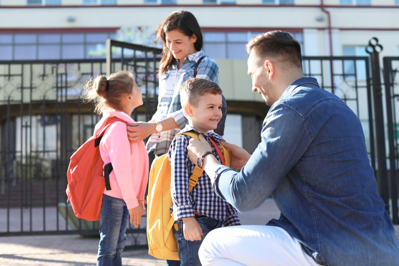 Parents sending their kids to school